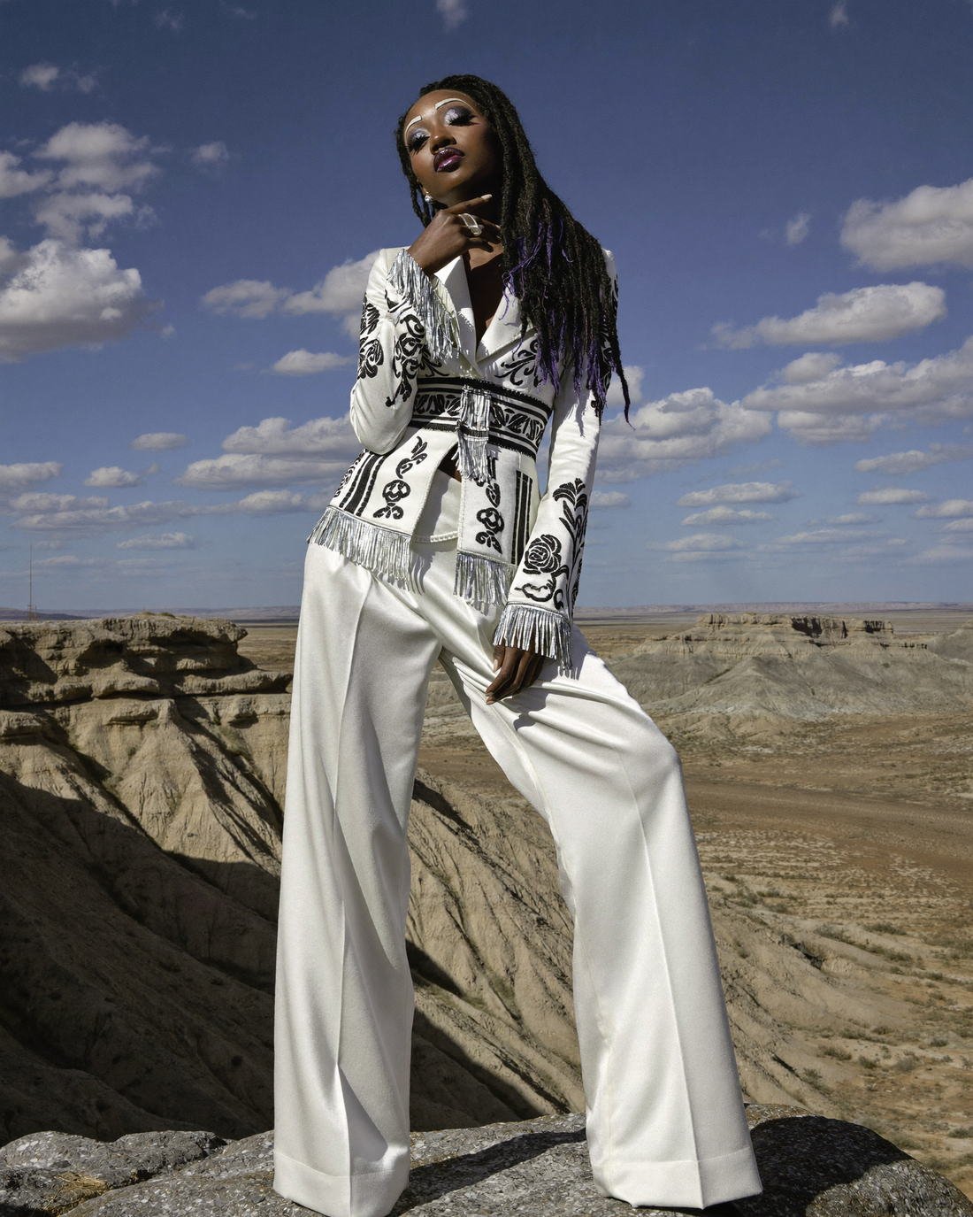White tailored couture in the desert, Daughter of the Wind