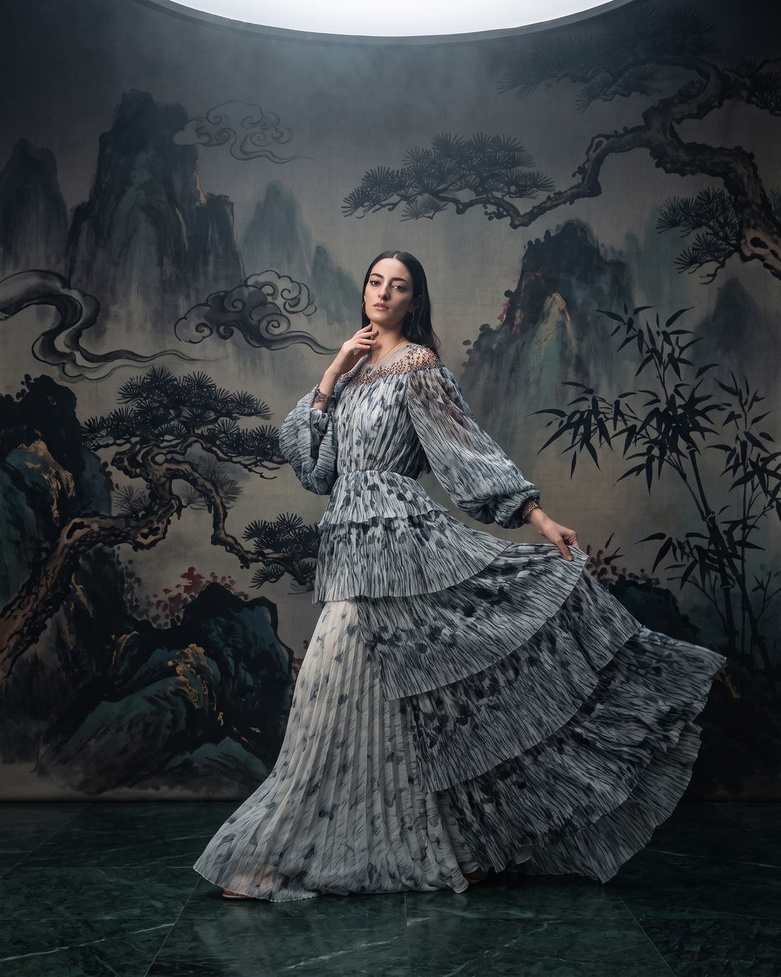 Ruffled gown against a painted mountain backdrop, Hanami