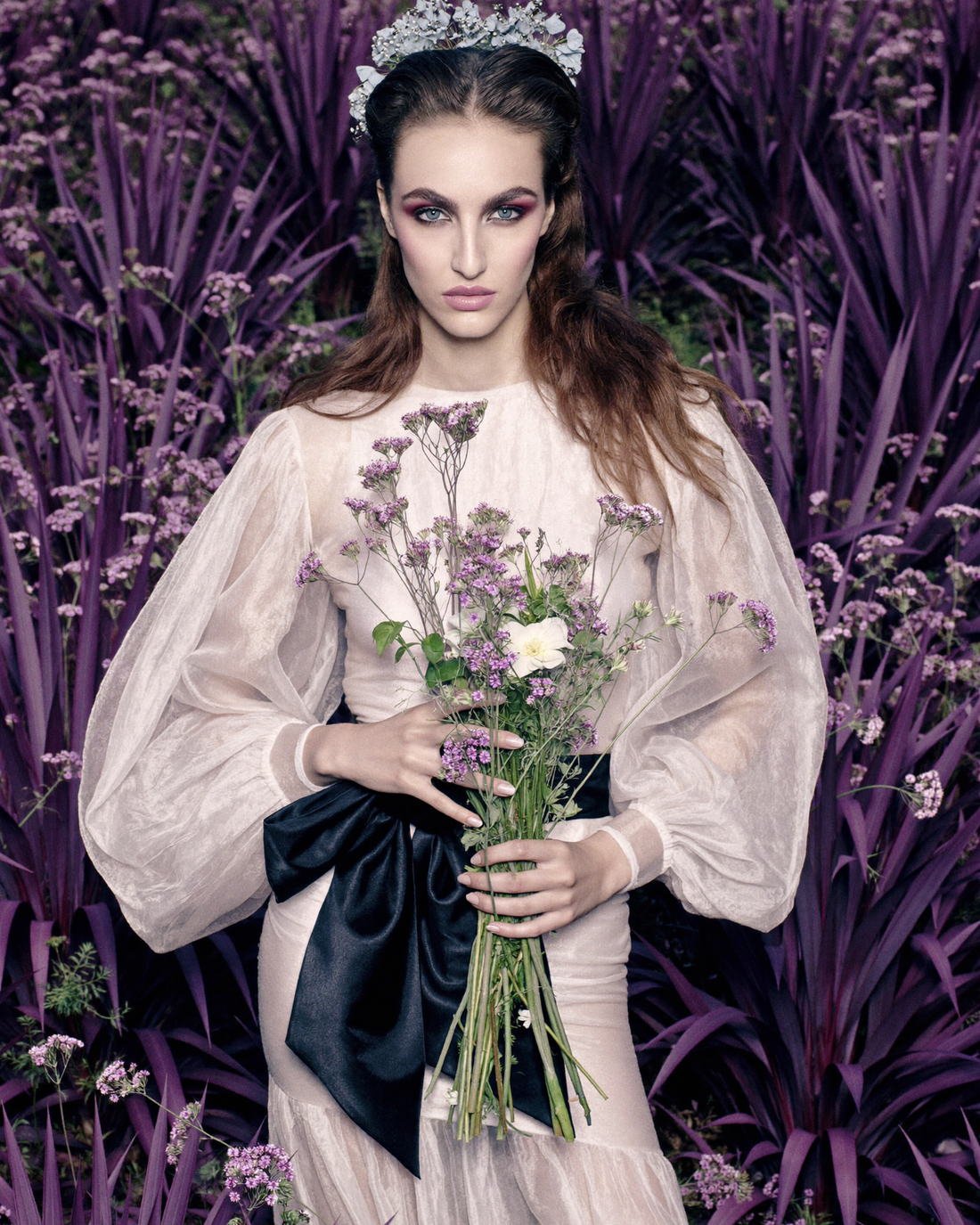 Sheer organza gown with black sash in a garden, The Artifact Edit