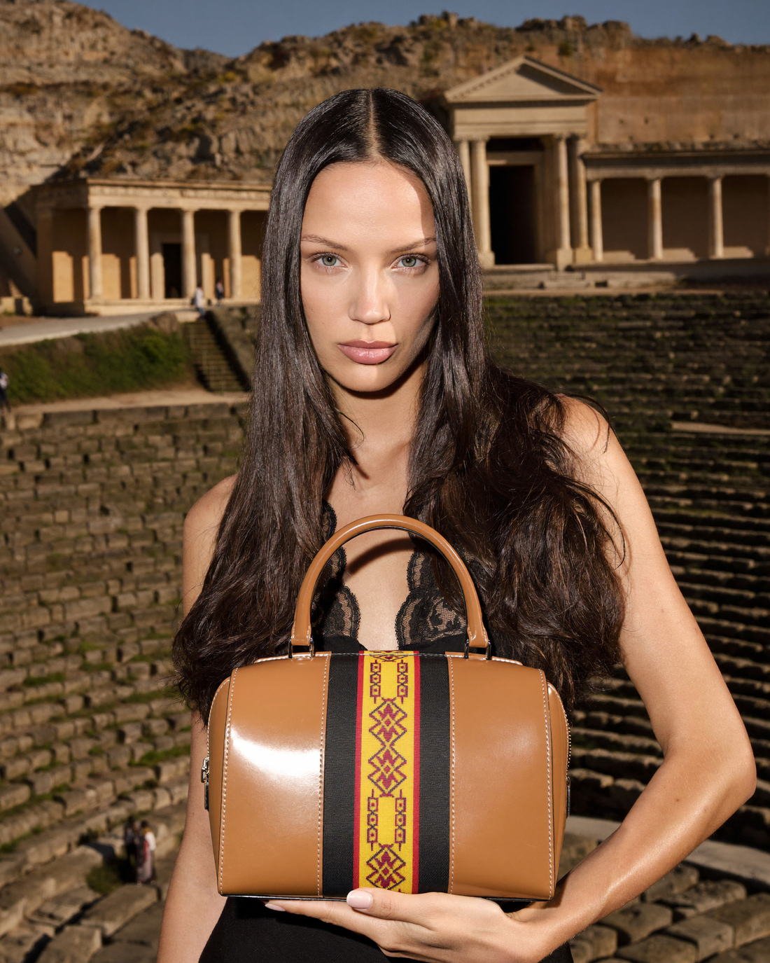Tan leather handbag presented in an amphitheatre, Unearthed
