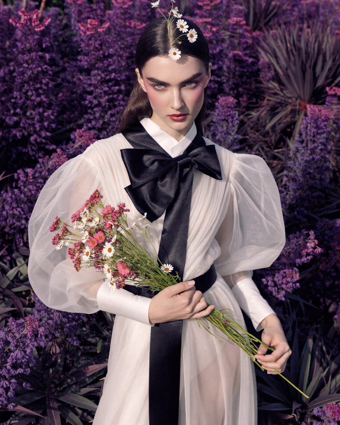 Organza gown with black sash in a flowering garden, The Artifact Edit
