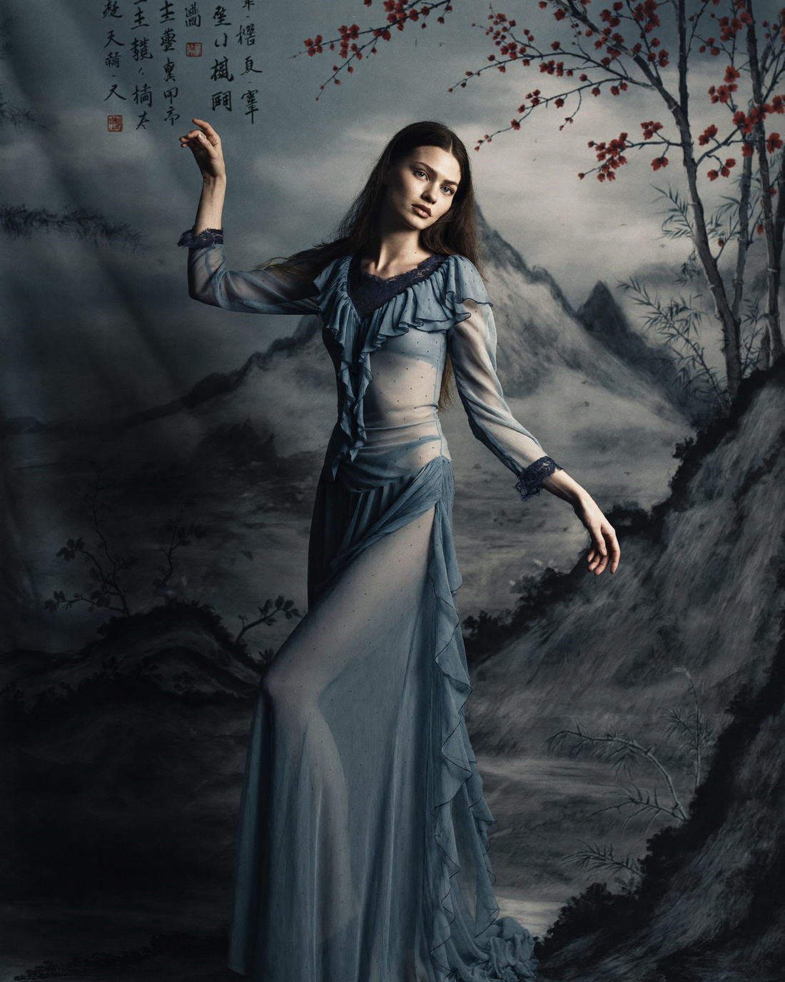 Sheer layered gown against painted mountains, Hanami