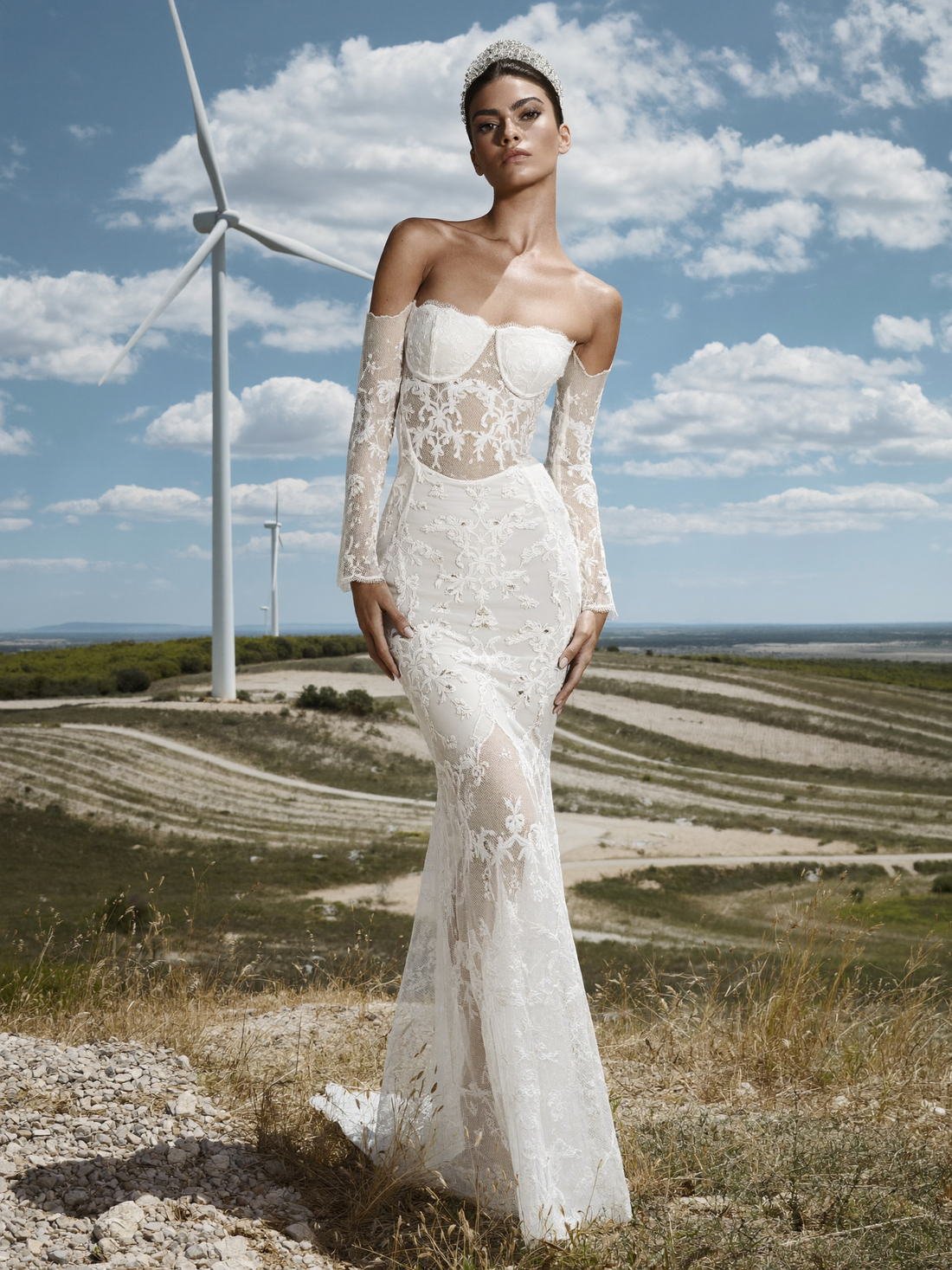 Lace bridal gown among wind turbines, Grace Tailored