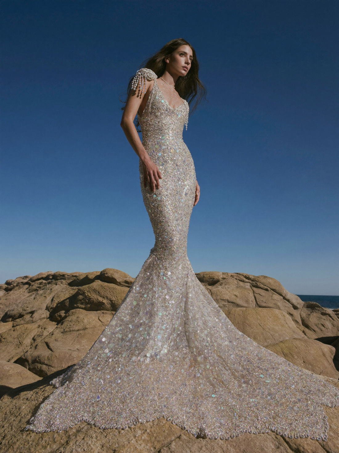 Beaded gown on coastal rocks, The Atelier Muse