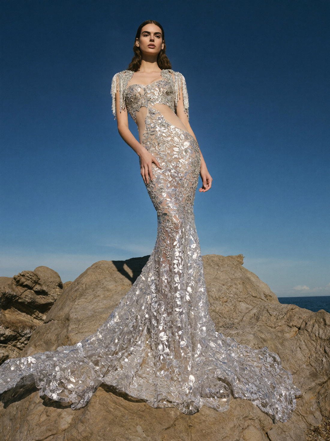 Embellished gown against sea and rock, The Atelier Muse