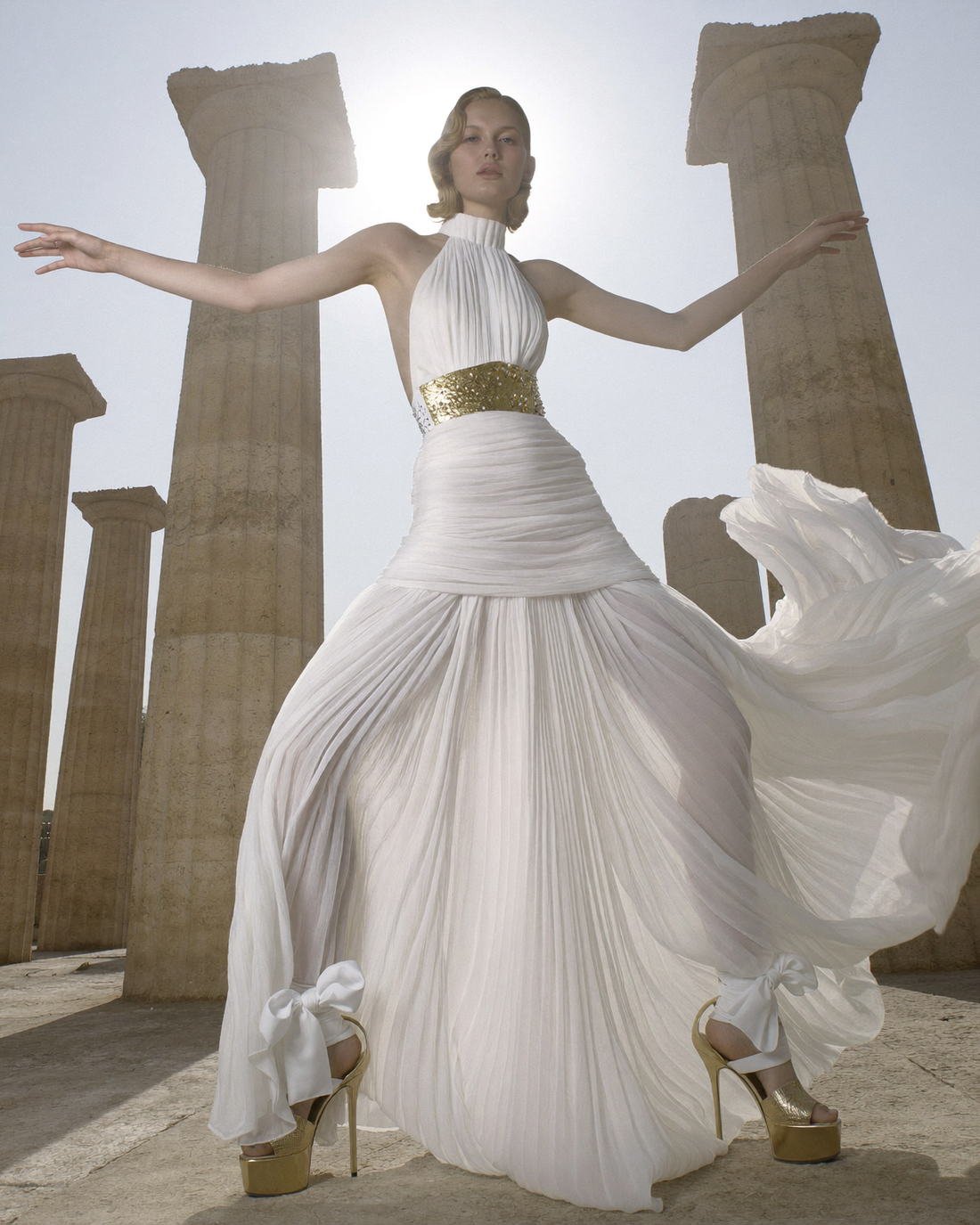 Silk gown lifted by wind between temple columns, Fragments of a Forgotten Queen