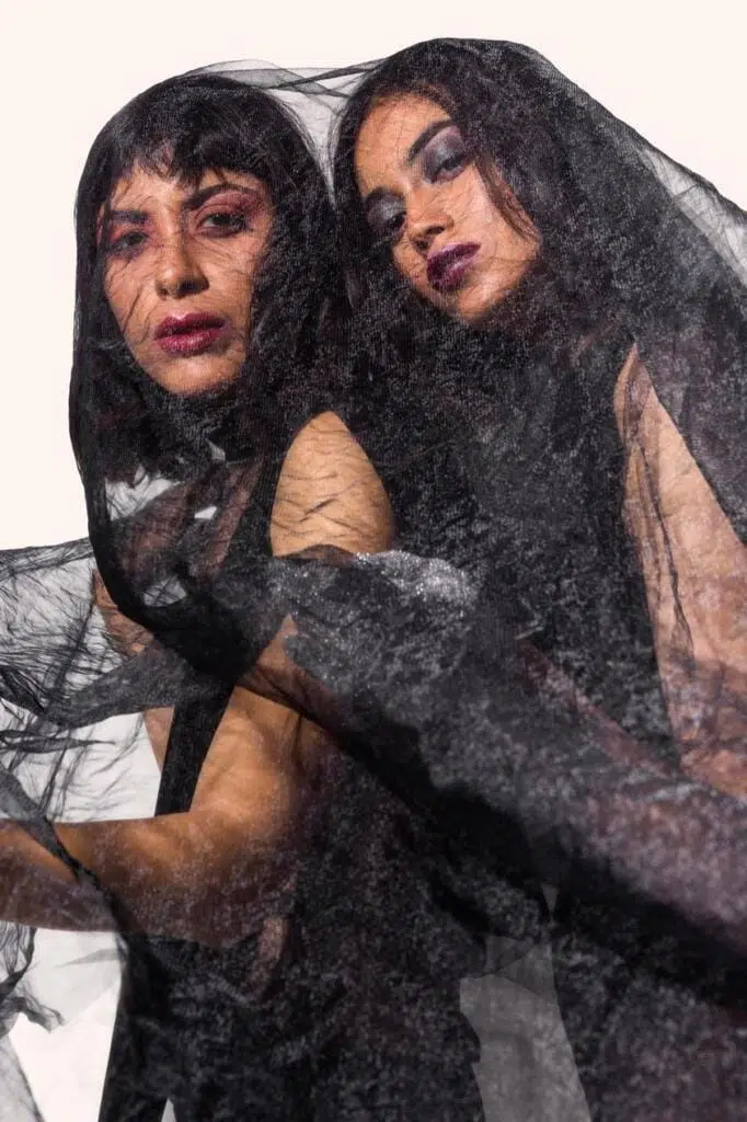 Artistic fashion photography using creative lighting and abstract poses for a unique visual narrative