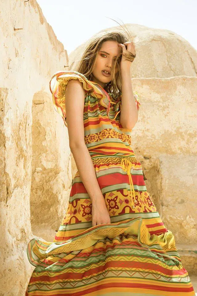 Artistic fashion photography using creative lighting and abstract poses for a unique visual narrative