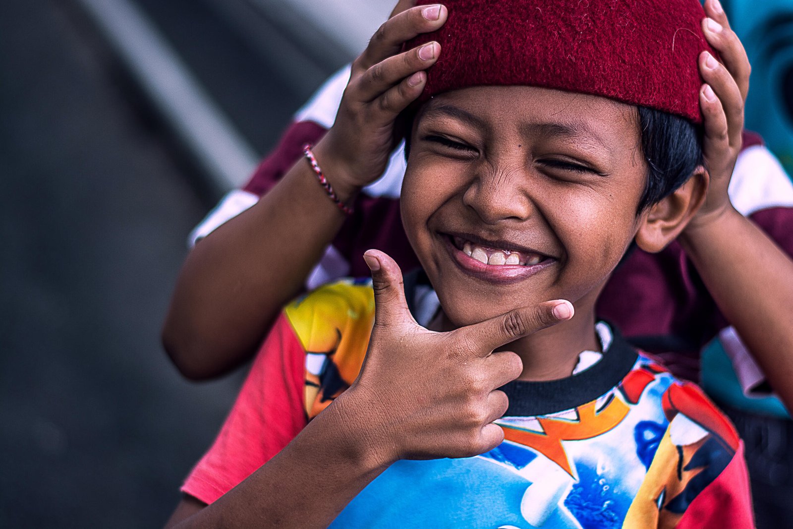 Documentary Photography Qatar 18 Smiling boy in a red cap, Bali