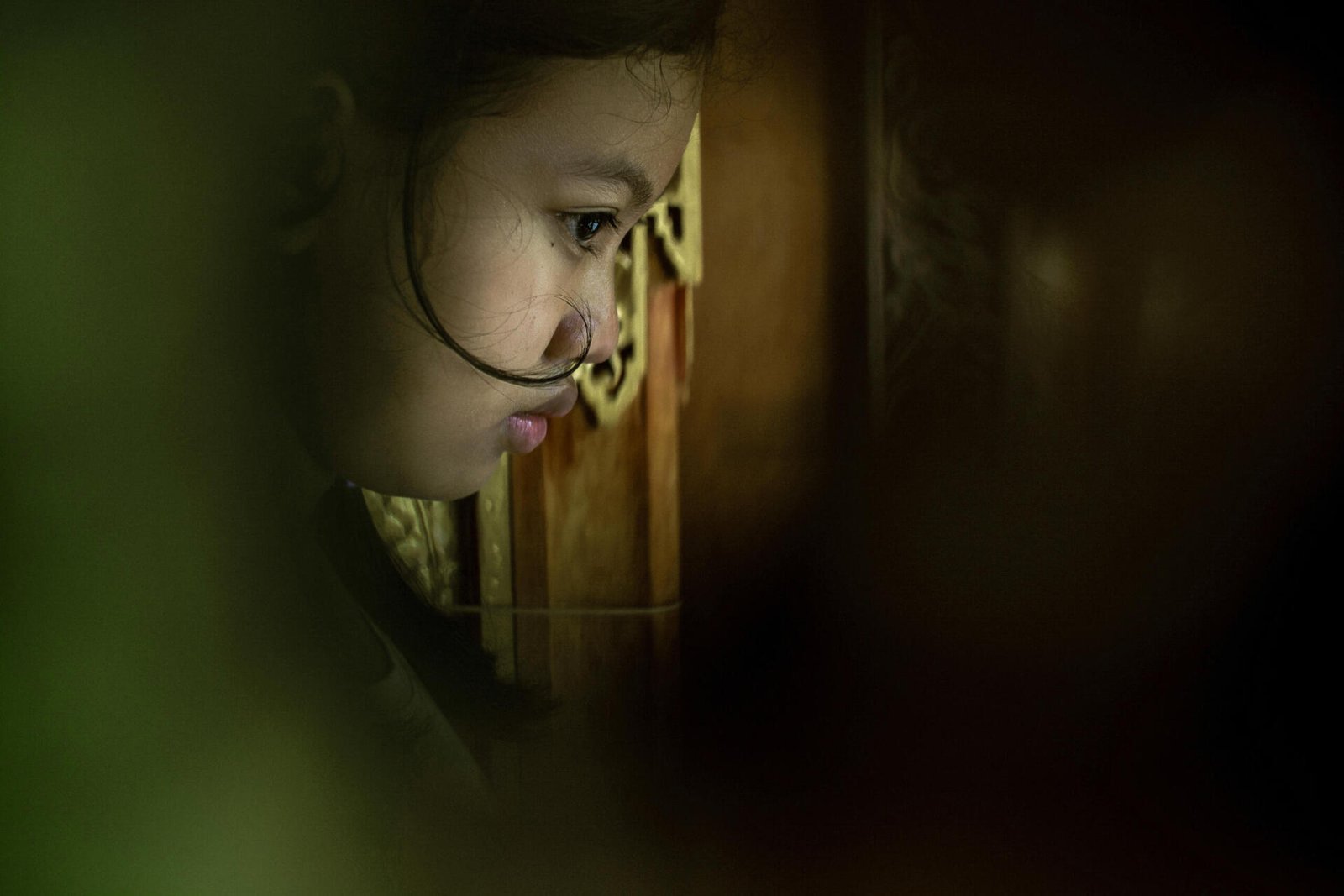 Documentary Photography Qatar 24 Portrait of a young woman in low light, Bali