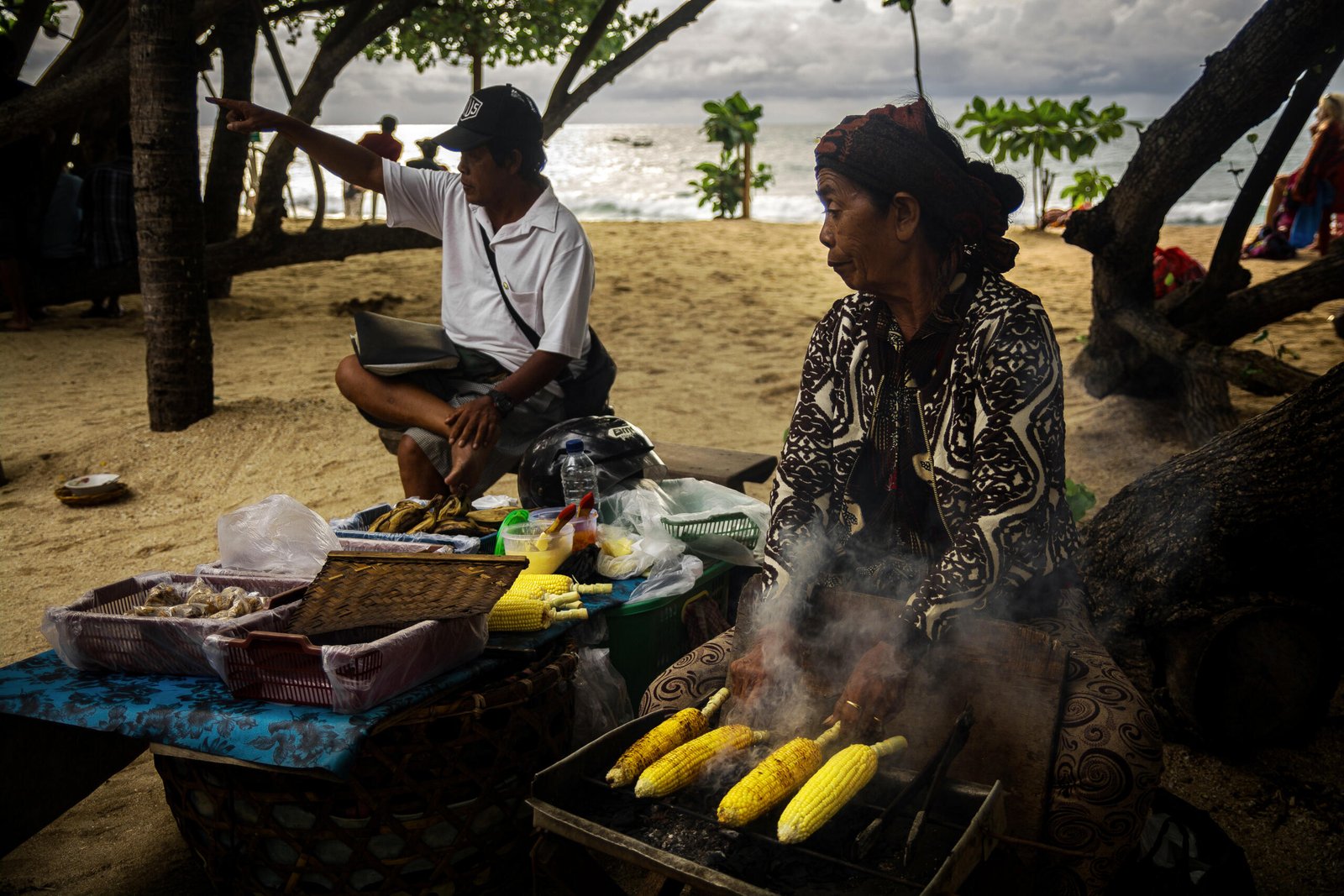 Documentary Photography Qatar 31 Corn grilling on the beach at dusk, Bali