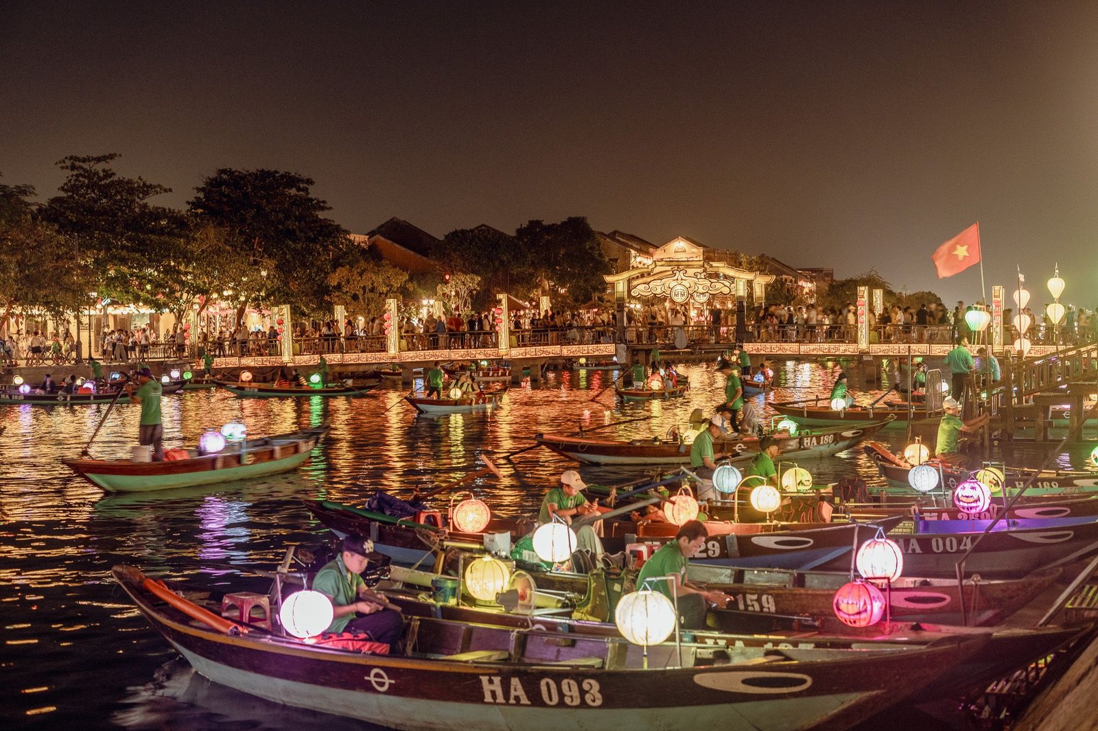 Documentary Photography Qatar 2 Boats strung with lanterns on the Thu Bon River at night, Hoi An
