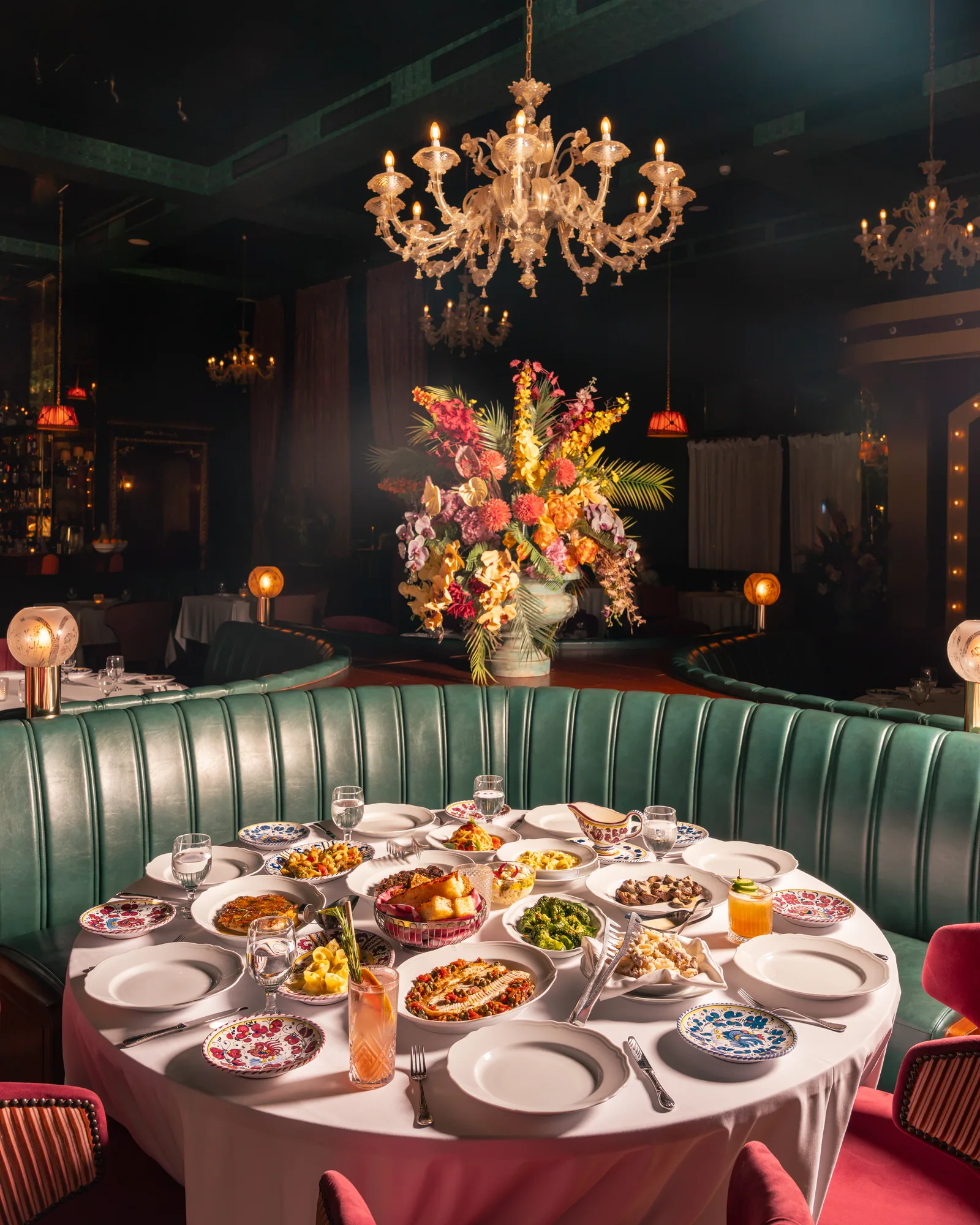 Carbone Doha dining room under the chandelier with a set table in the foreground
