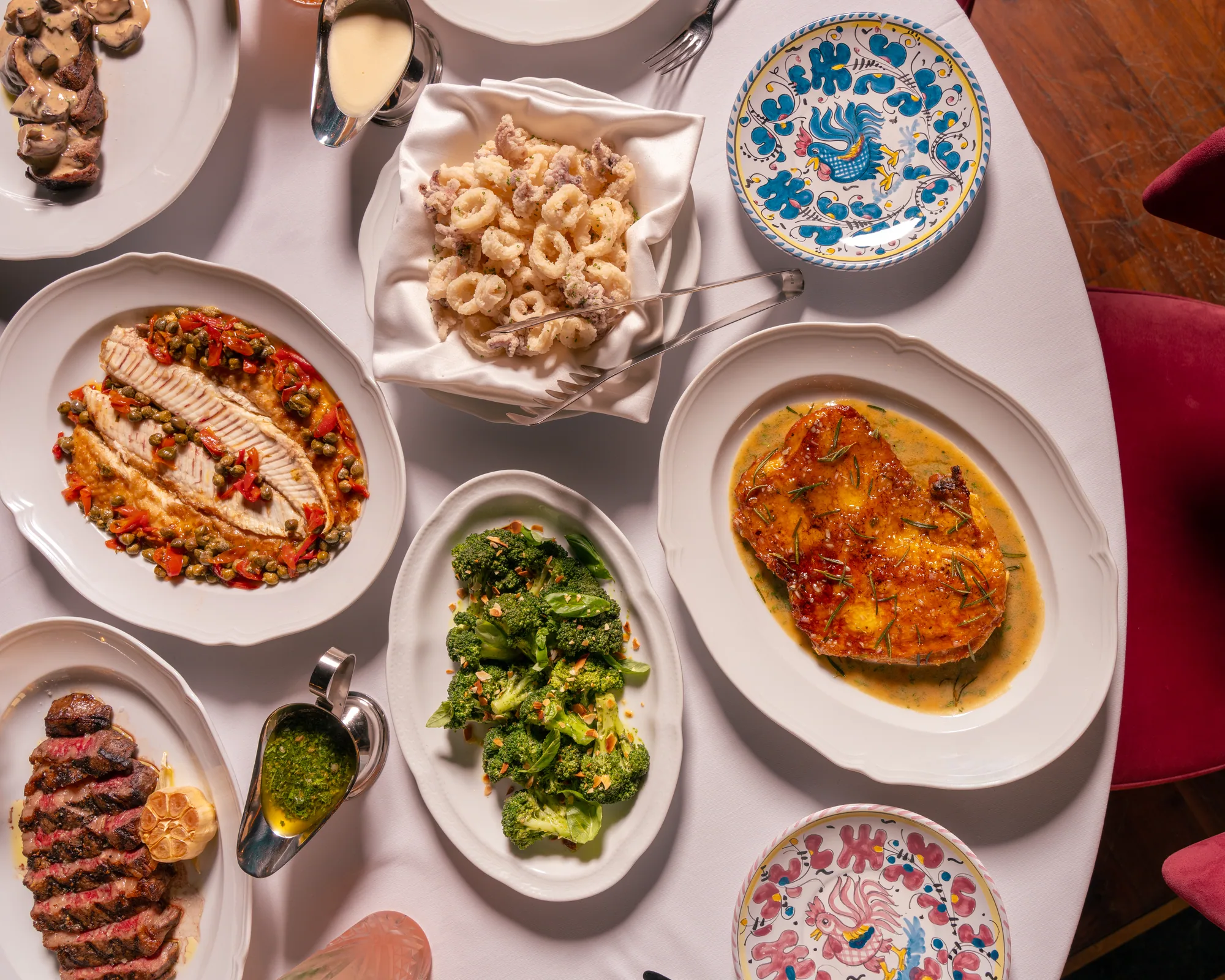 Table at Carbone Doha photographed mid-service with plates and glasses in use