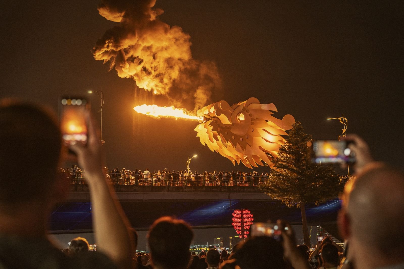 The Dragon Bridge breathing fire over the Han River in Da Nang