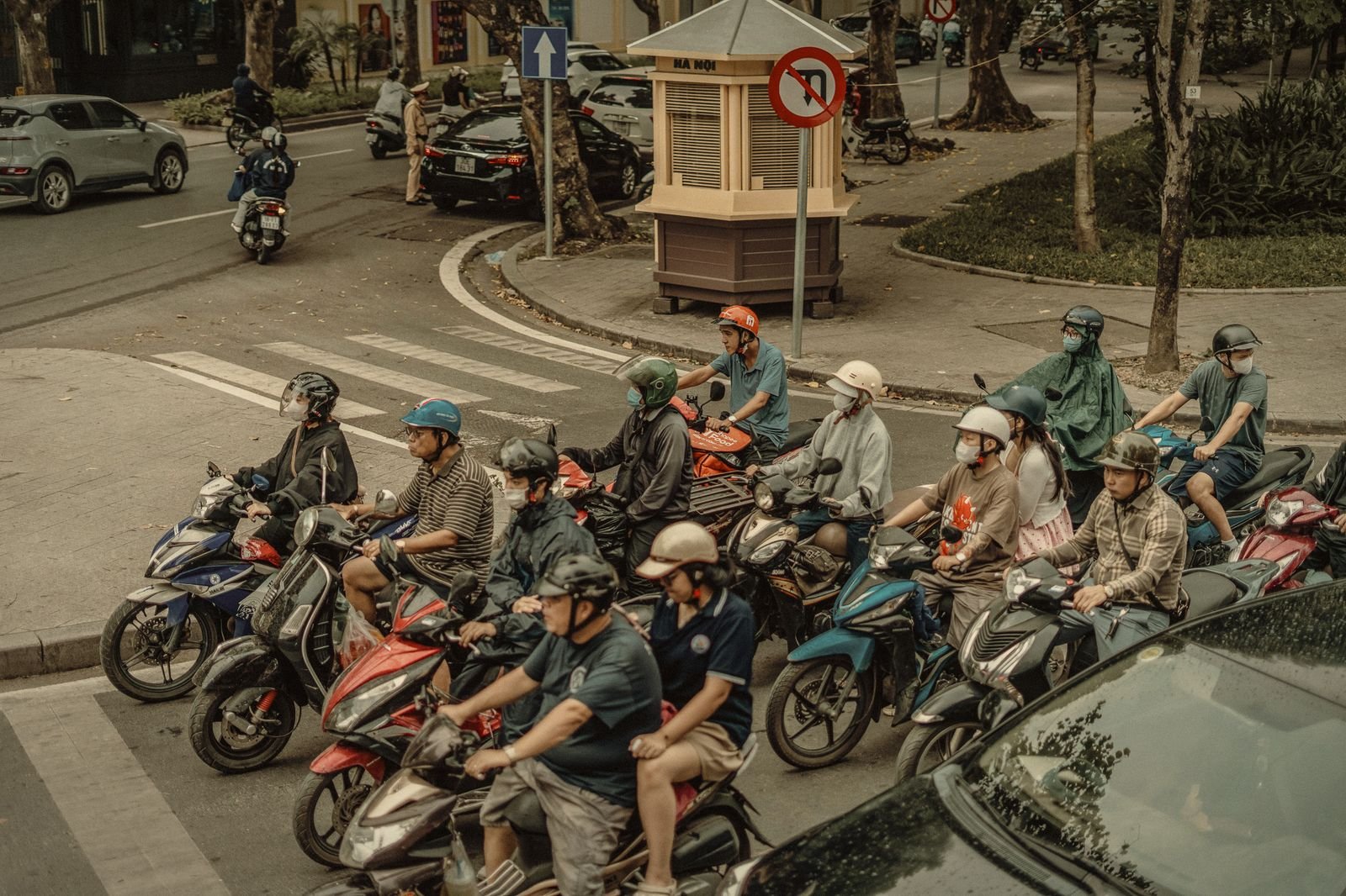 Motorbikes waiting at a Hanoi traffic light