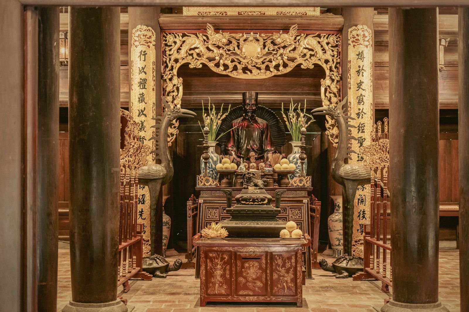 A gilded altar inside a Hanoi temple