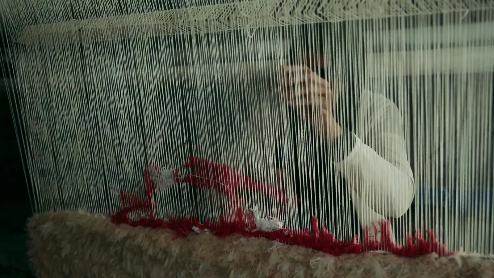 Video production case study: hands at a traditional loom, still from the ILO decent work films in Tunisia