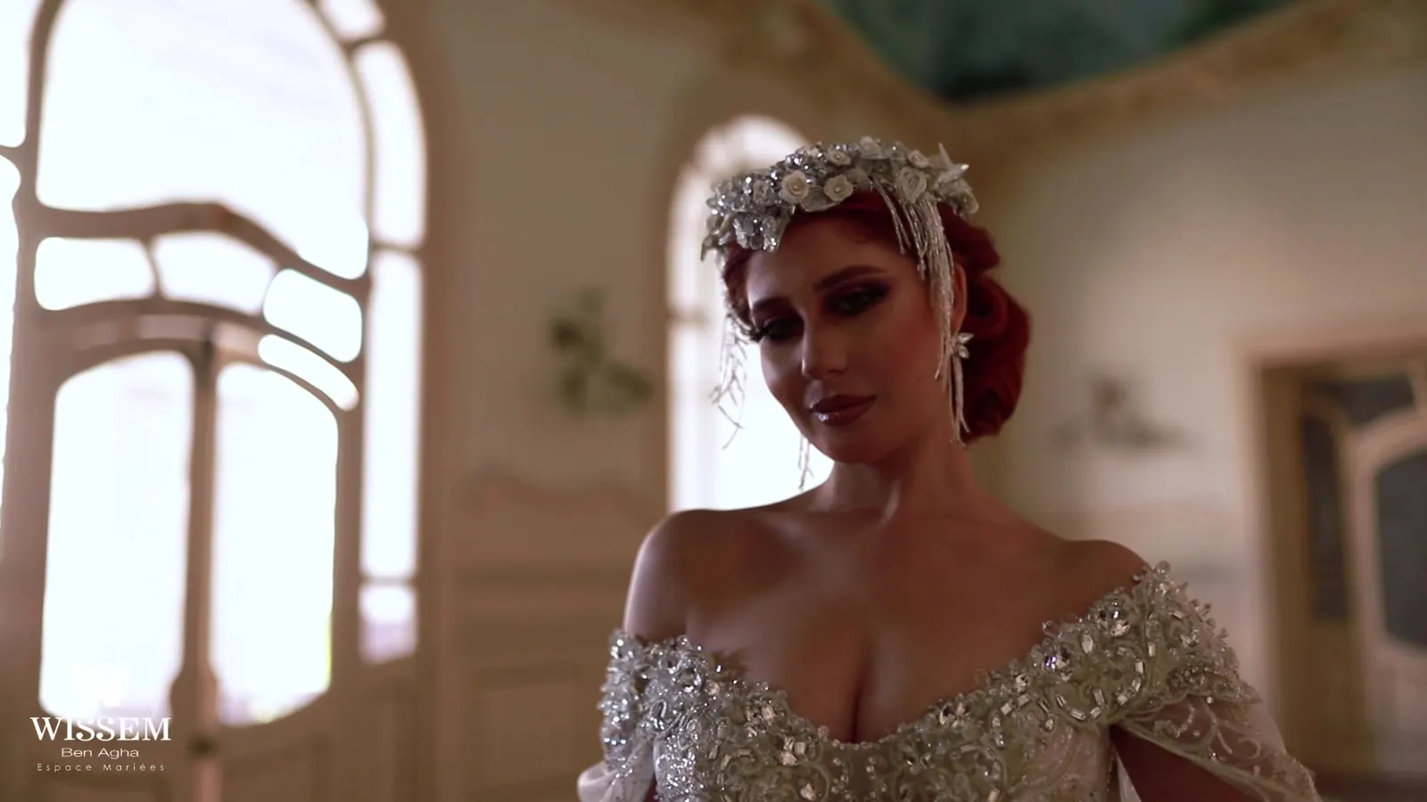 Brand film case study: a bride in a beaded Wissem Ben Agha gown beside an arched window, still from In a Dream