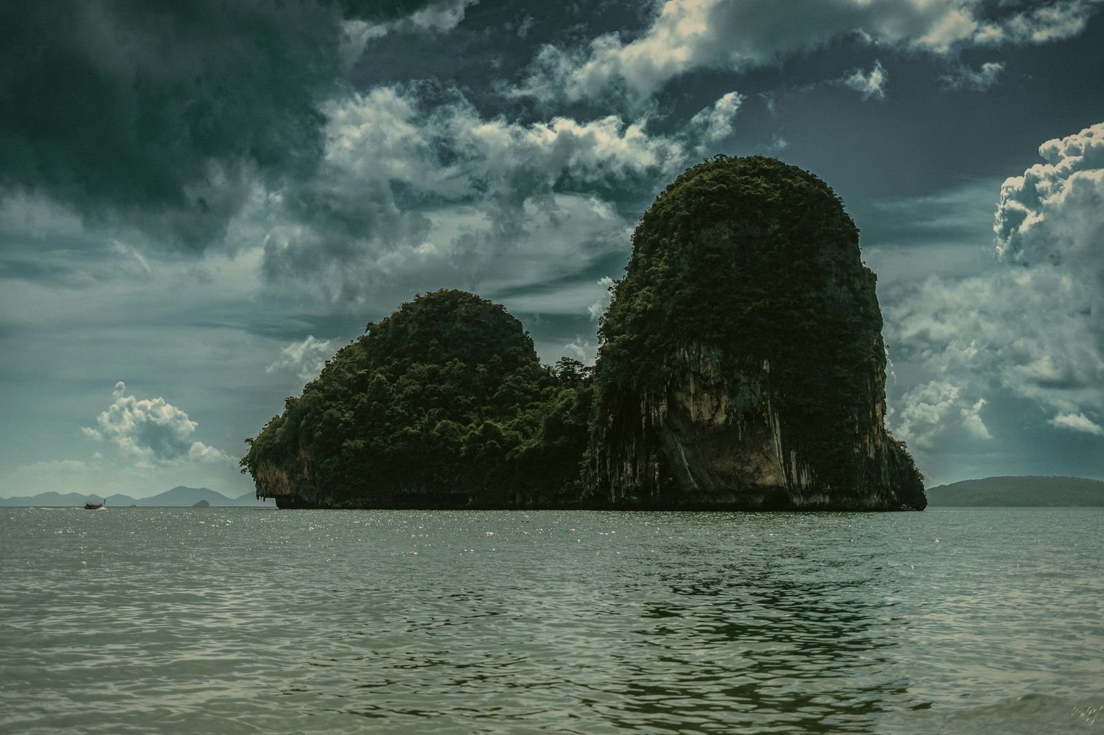 Jungle-topped karst island rising out of the Andaman Sea near Krabi