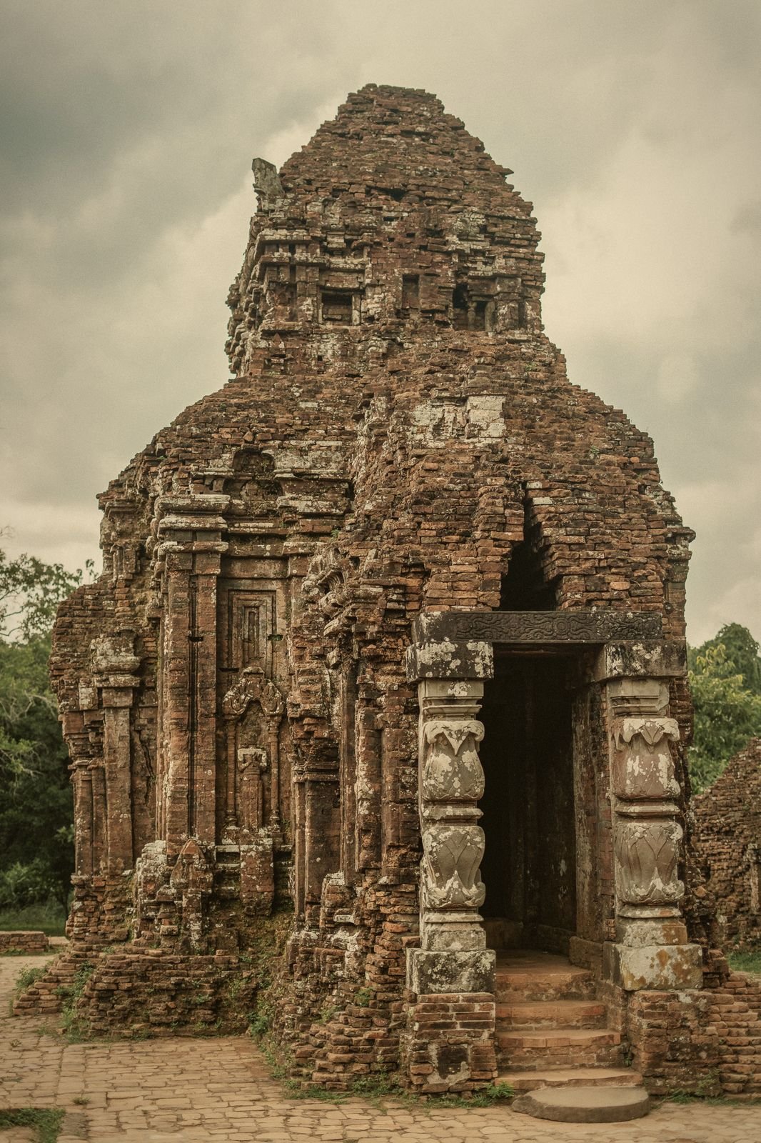 A restored Cham brick tower with its doorway at My Son