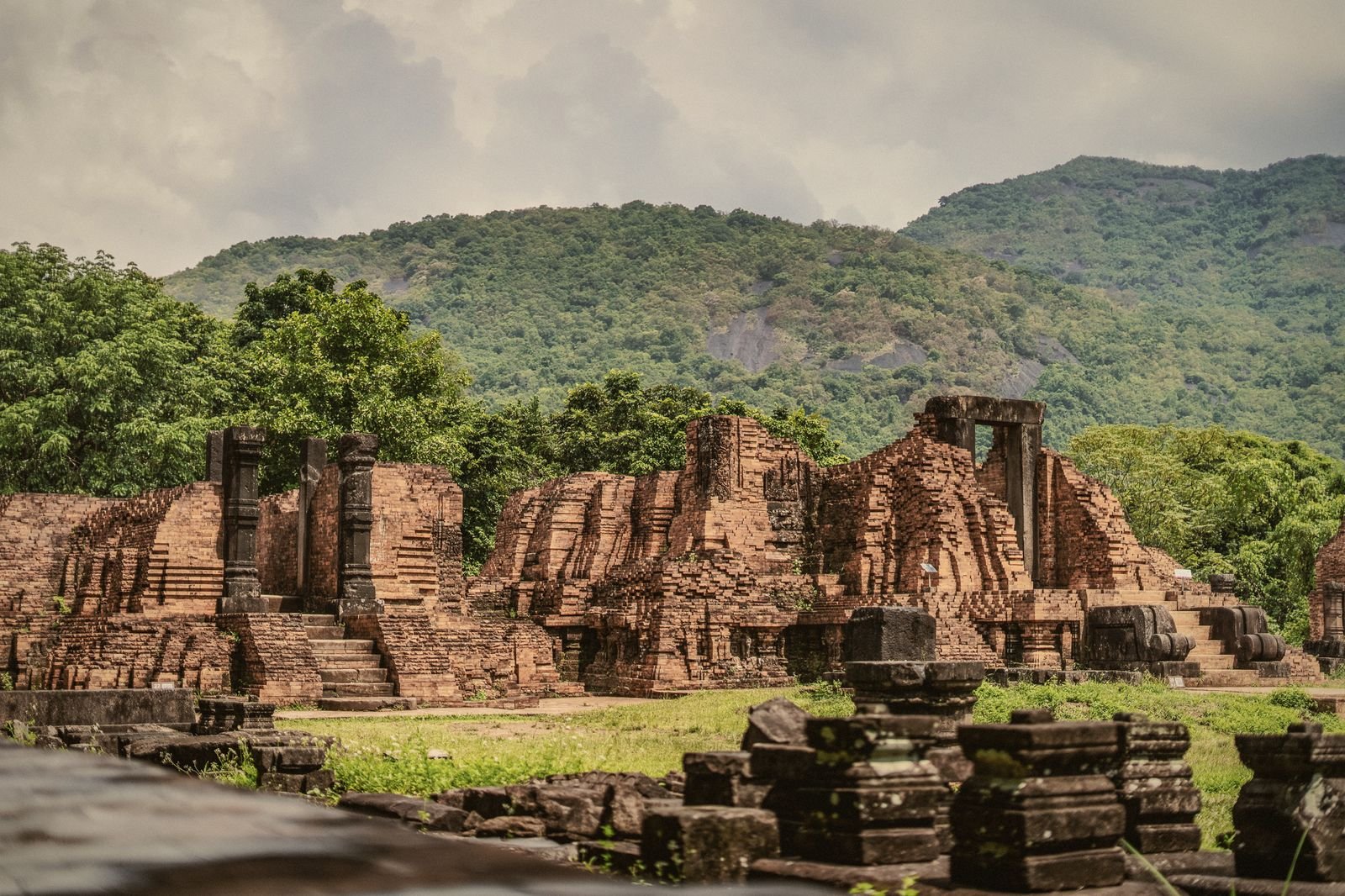 The brick tower-temples of My Son Sanctuary below forested mountains