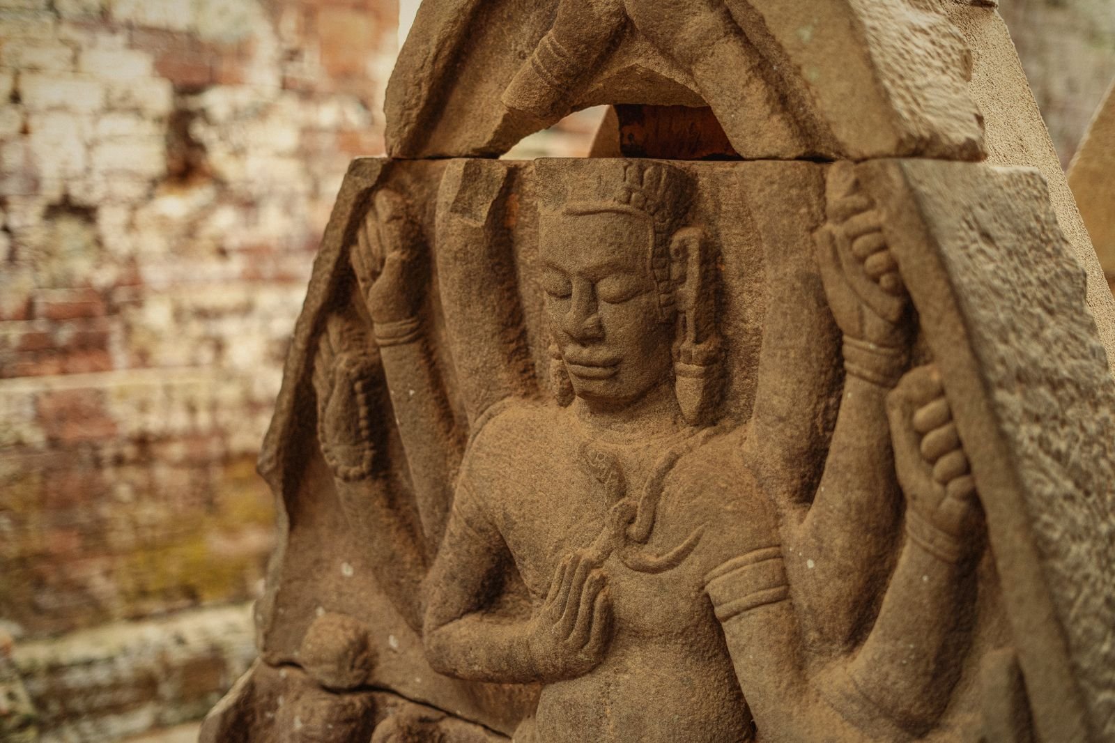 Close detail of a sandstone deity relief at My Son