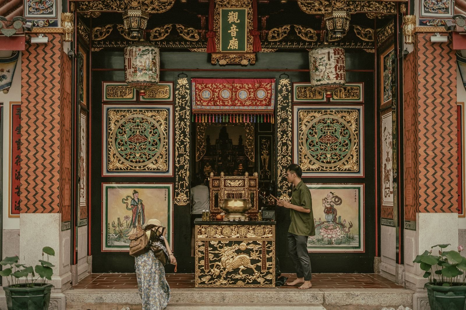The carved gold-and-red facade of a Guan Yin shrine in Phuket Old Town