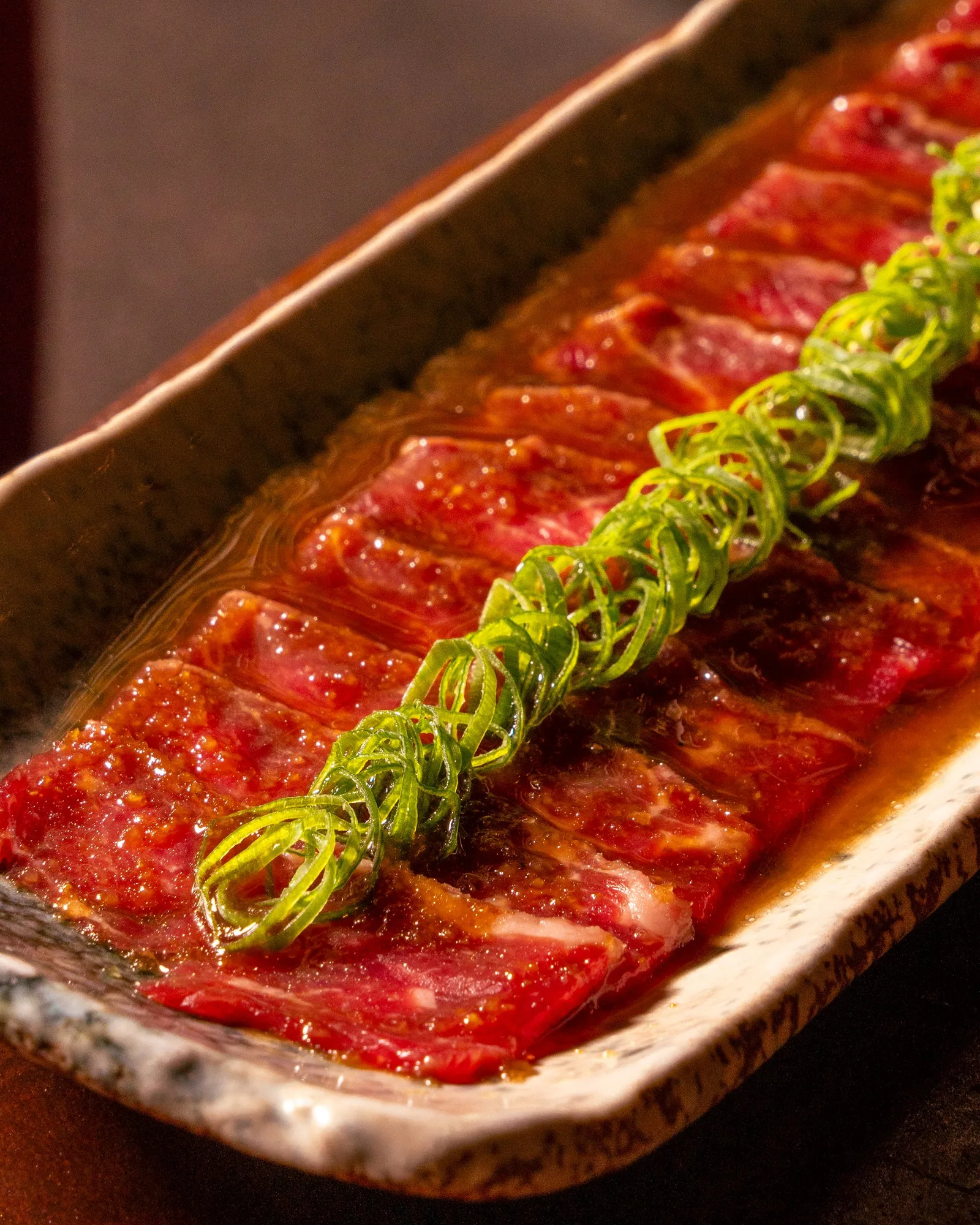 Seared beef tataki slices at Zuma Doha, Yashoku Night Brunch