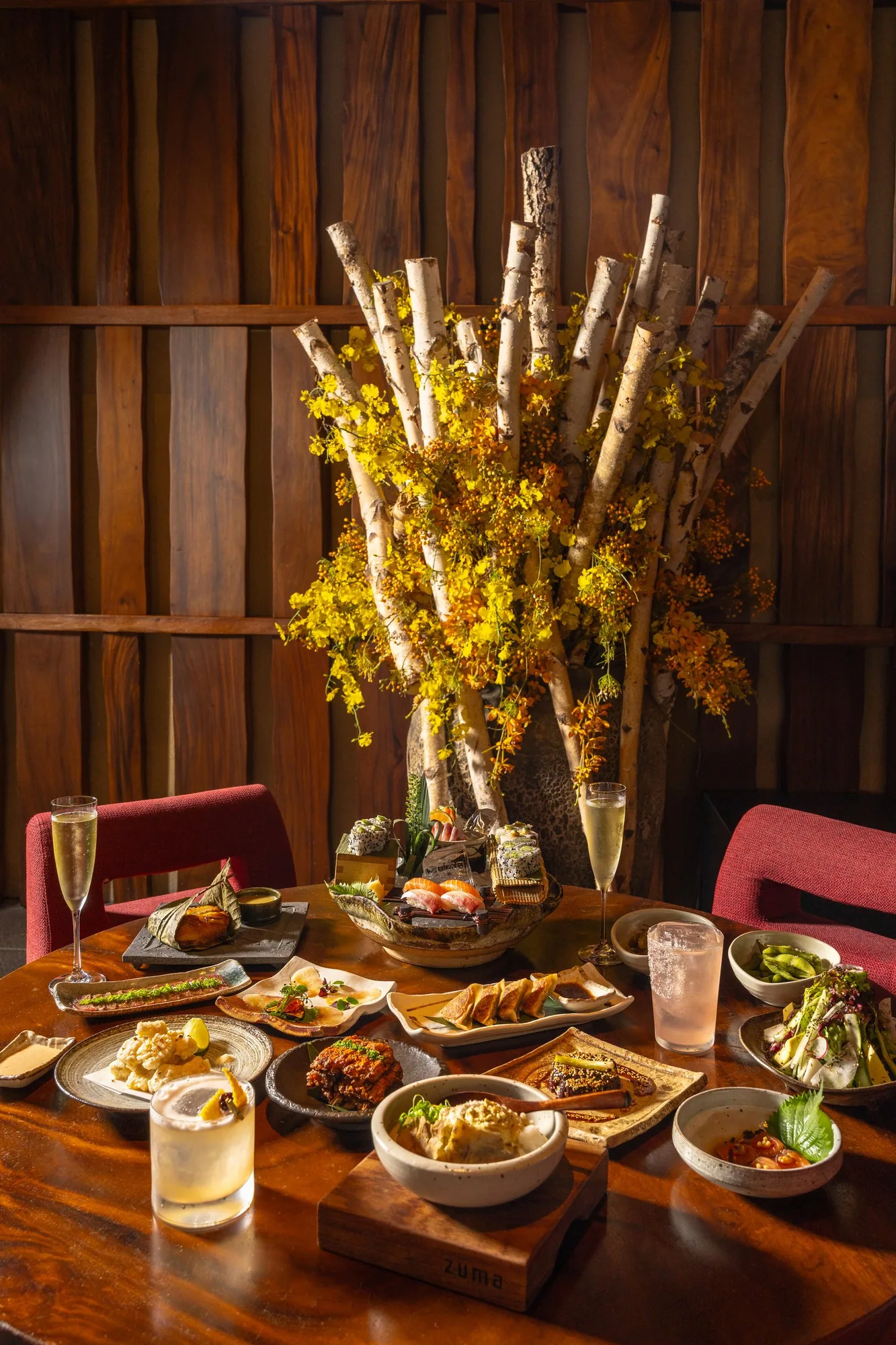 Food photography case studies: the Zuma Doha Yashoku Night Brunch table under warm low light