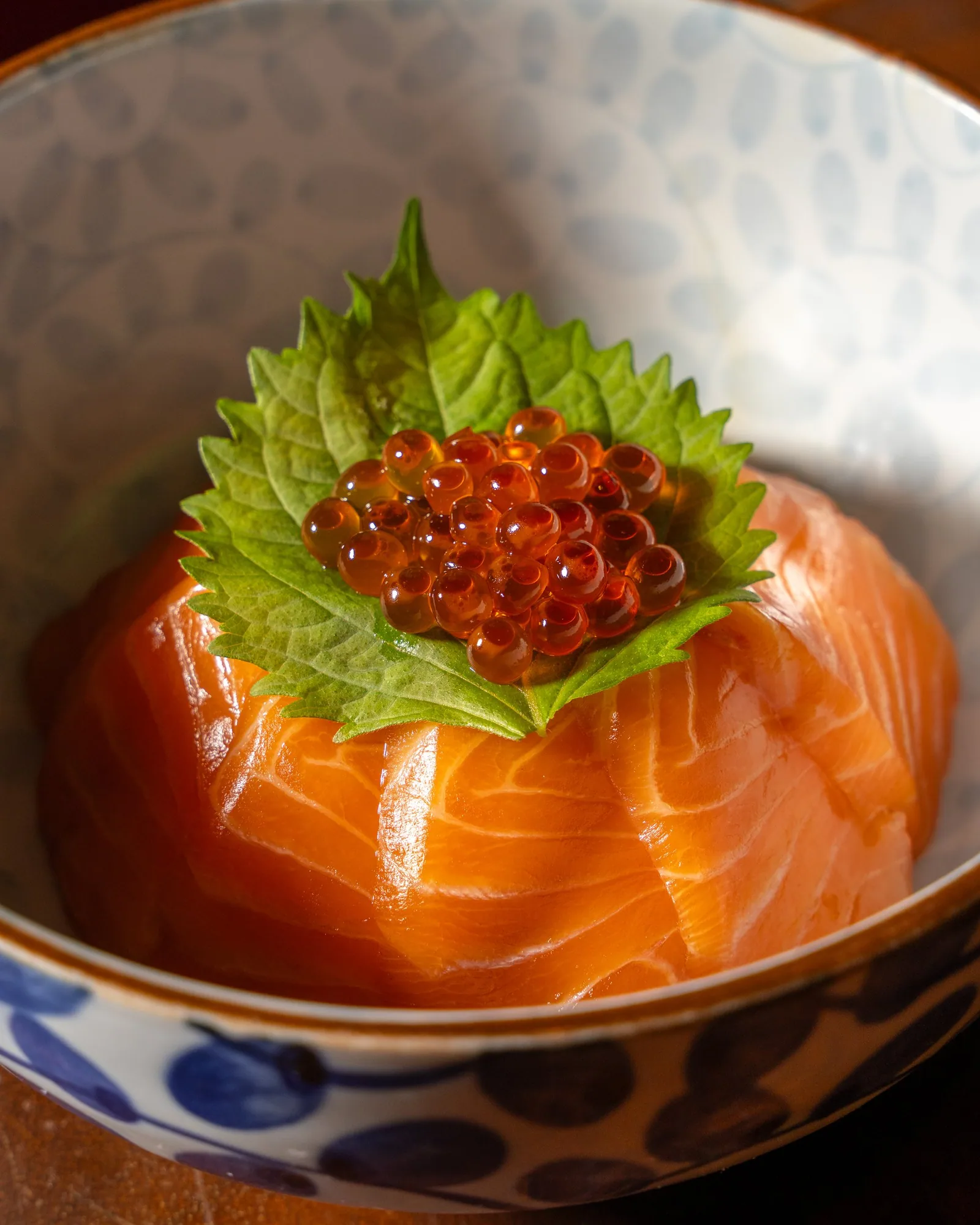Salmon and ikura don with a shiso leaf at Zuma Doha, Ebisu Lunch menu